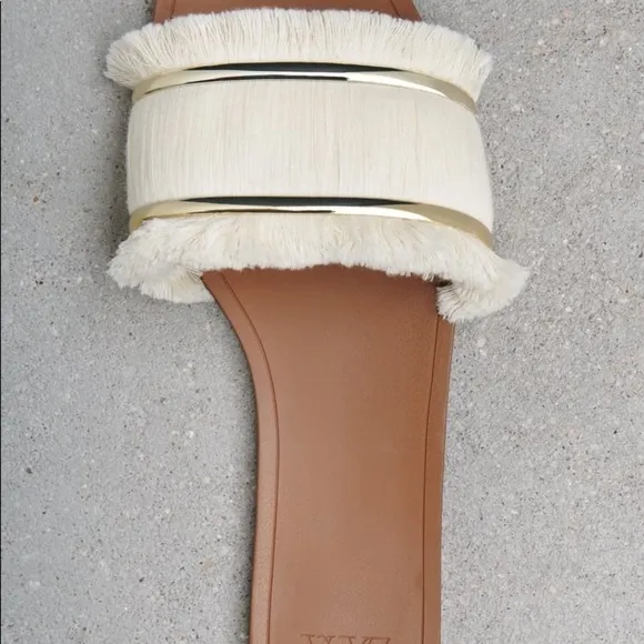FRINGED FLAT SANDALS