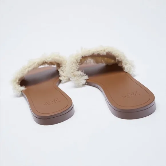 FRINGED FLAT SANDALS