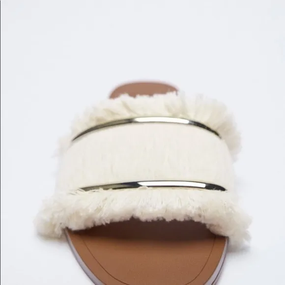 FRINGED FLAT SANDALS