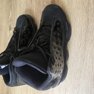 Jordan Black Sneakers with Chunky Midsole and Modern Aesthetic