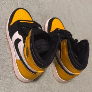 Jordan Yellow and Black High-Top Sneakers