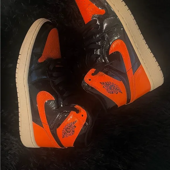 Jordan’s Orange and Black High-Top Sneakers
