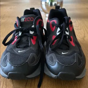 Nike Black and Red Sneakers with Chunky Design