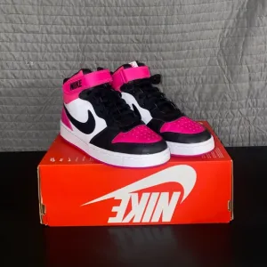 Nike Pink and Black High-Top Sneakers