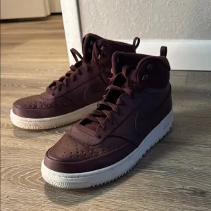 Nike Red Sneakers with High-Top Design and Textured Material