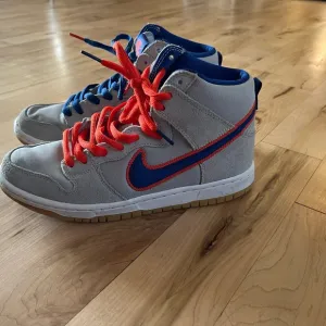 Nike SB High-Top Sneakers - Gray and Orange.