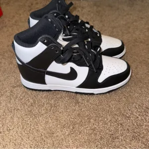 Nike womens Black and White High-Top Sneakers