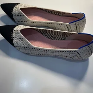 Rothy's Black and Cream Pointed Toe Flats