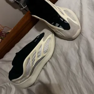 Yeezy Cream and Black Sneakers with Chunky Silhouette